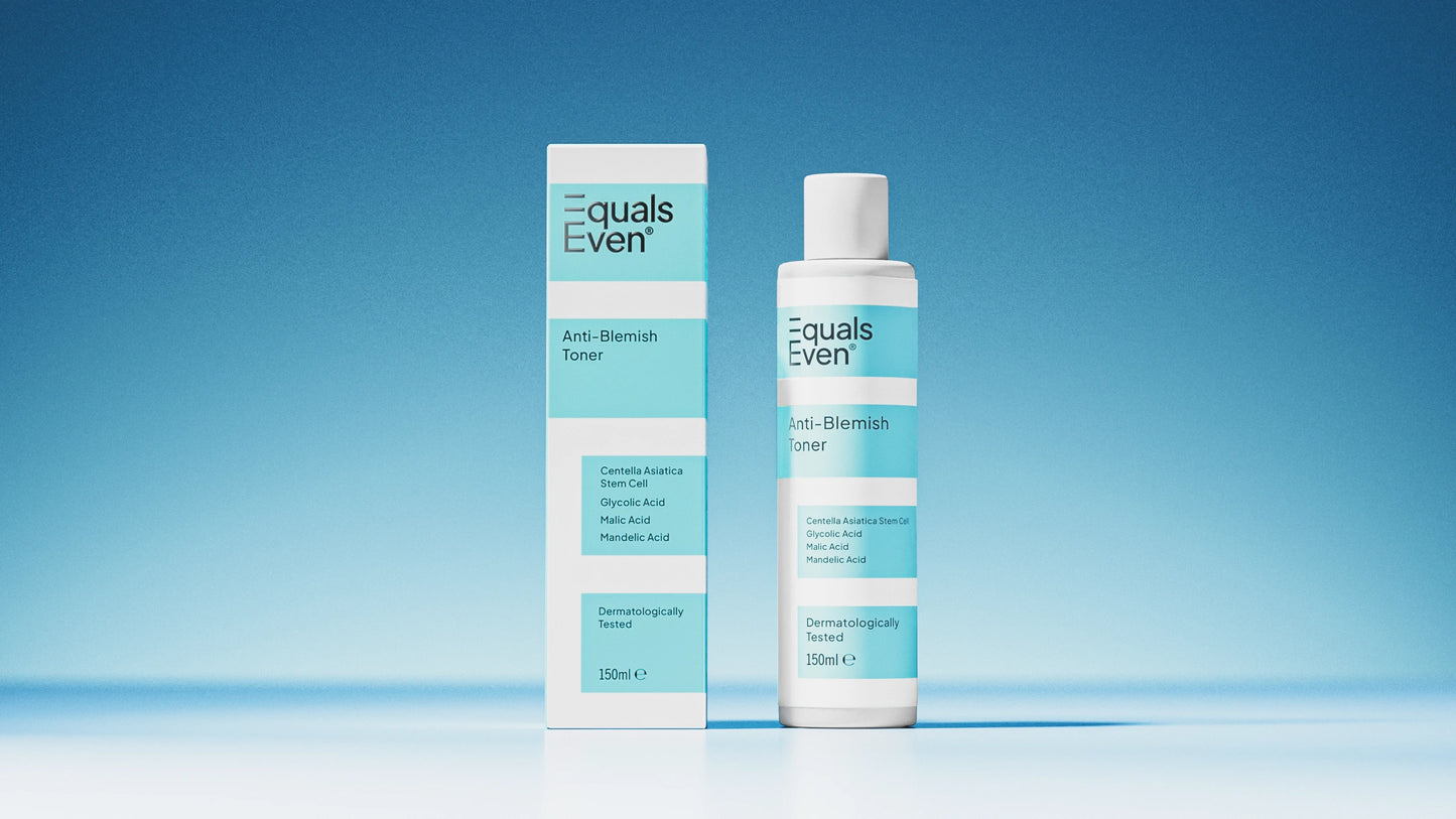 A bottle and box of Anti Blemish Toner, featuring white packaging with light blue accents and product details, are shown against a blue gradient background. This toner is designed to unclog pores and promote glowing skin.