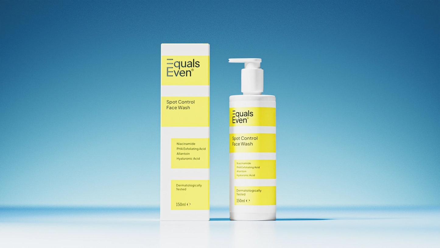 A bottle and box of Spot Control Face Wash are shown against a blue background, each with white and yellow labels. The bottle features a pump dispenser. This gentle cleanser purifies your skin while caring for it.