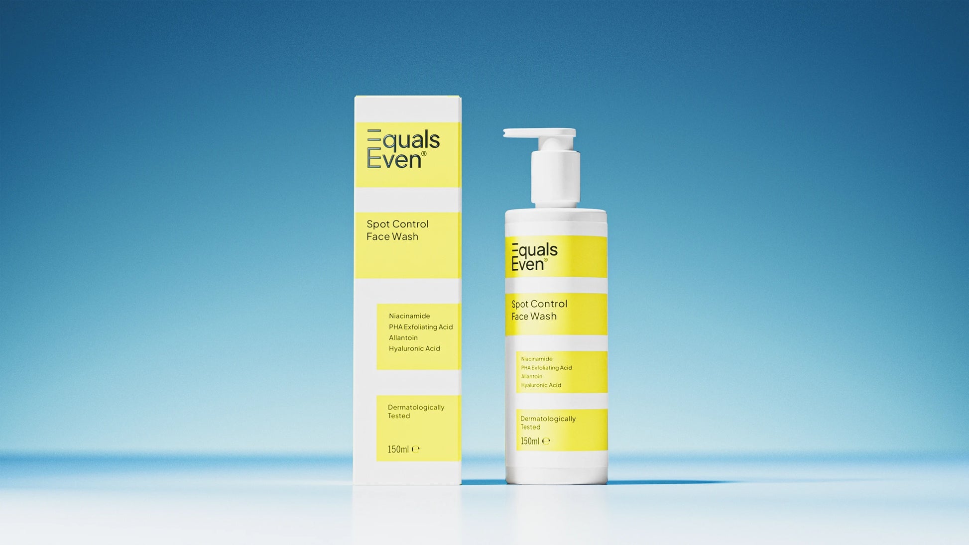 A bottle and box of Spot Control Face Wash are shown against a blue background, each with white and yellow labels. The bottle features a pump dispenser. This gentle cleanser purifies your skin while caring for it.