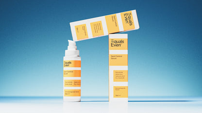 Three Spot Control Serum bottles and boxes are displayed against a blue background. The white and yellow packaging highlights this blemish serum, which helps fade post-blemish marks for smoother skin. Two boxes stand upright, others lie horizontally on top.
